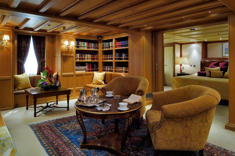 Oak-panelled boasting the original onyx fireplace, while the bedroom is illuminated by authentic Baccarat crystal wall lights.